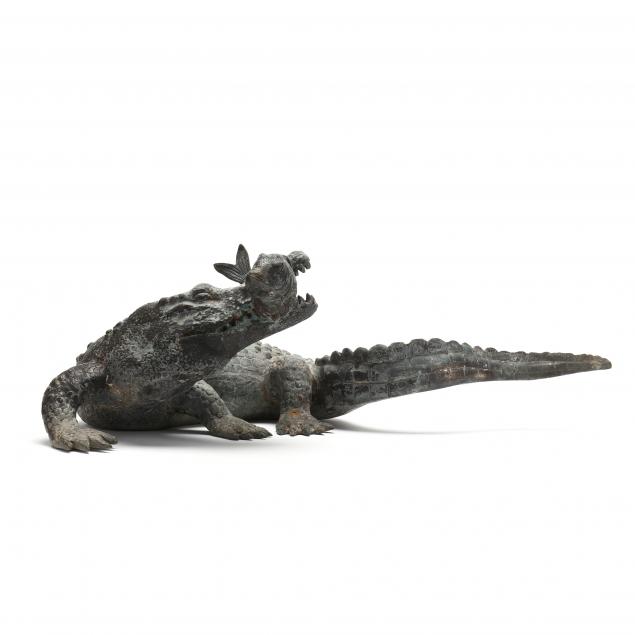 cast-bronze-statue-of-an-alligator-devouring-fish