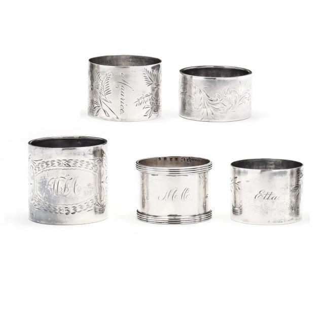 an-assembled-set-of-five-sterling-silver-napkin-rings