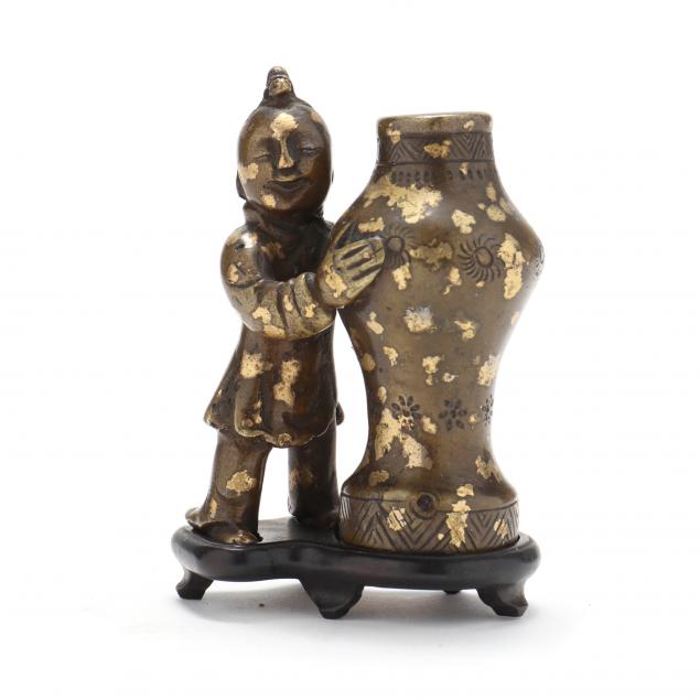 a-chinese-gilt-splashed-bronze-sculpture-of-a-boy-with-vase