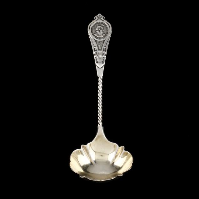 an-american-coin-silver-medallion-pattern-sauce-ladle-by-albert-coles