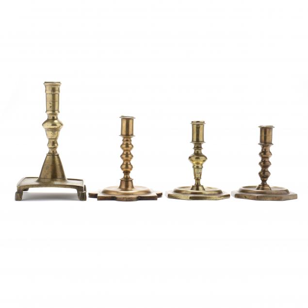 four-antique-continental-brass-candlesticks