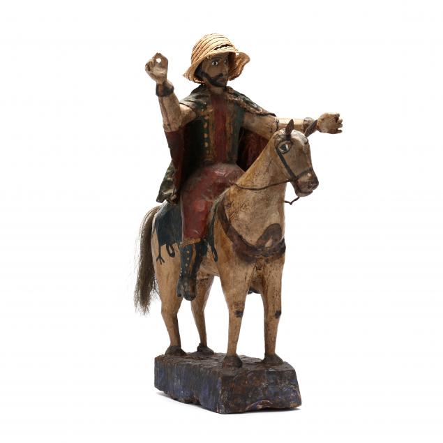 a-carved-spanish-folk-figure-of-a-horse-and-rider