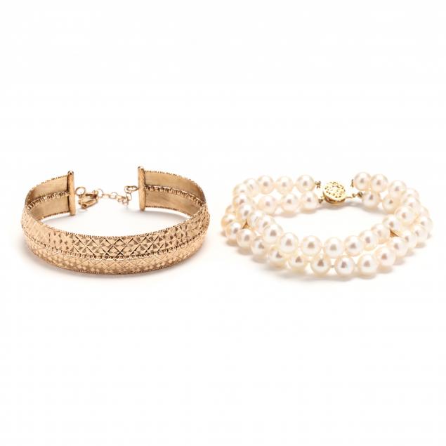 a-double-strand-pearl-bracelet-and-a-gold-bracelet