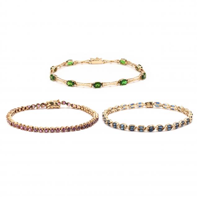 three-gold-and-gem-set-bracelets