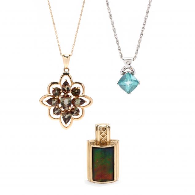two-gold-and-gem-set-necklaces-and-a-gem-set-pendant-slide