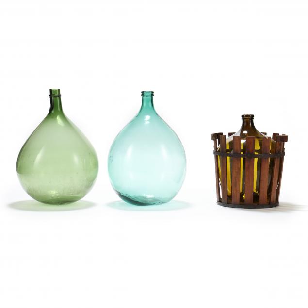 three-large-glass-demijohns