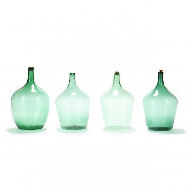 four-vintage-glass-demijohn-bottles