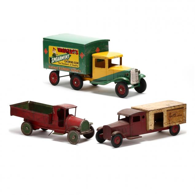 three-vintage-toy-pressed-steel-1930s-delivery-trucks