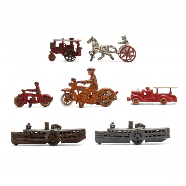 group-of-seven-vintage-cast-iron-toys