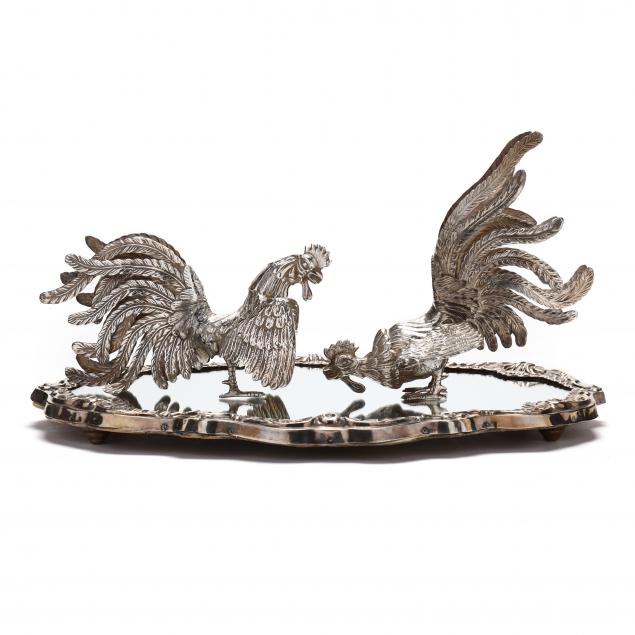 a-pair-of-sterling-silver-fighting-cocks-with-mirrored-plateau