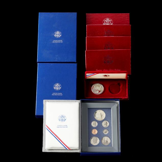 three-1986-prestige-proof-sets-and-five-1983-s-olympic-dollars