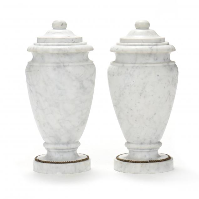 a-pair-of-carved-white-marble-urns
