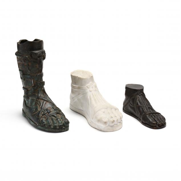 three-models-of-roman-sandaled-feet-in-marble-and-bronze