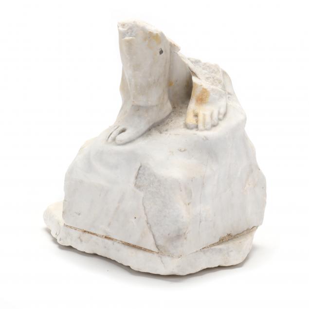 a-carved-marble-figural-fragment