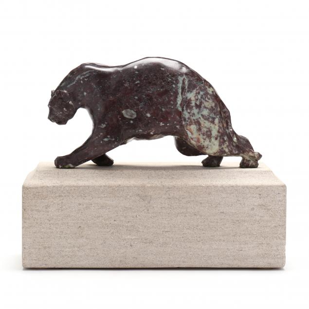 carved-purple-stone-sculpture-of-a-lurking-panther
