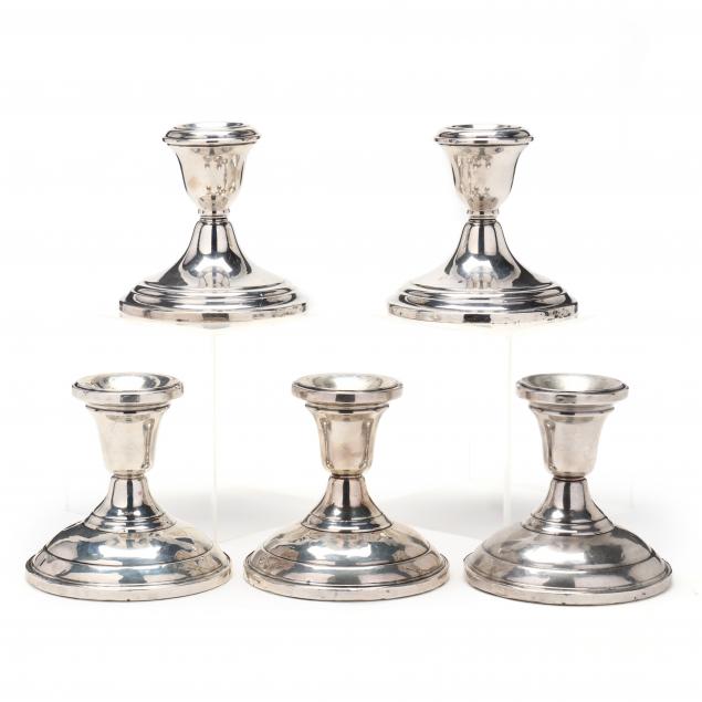 a-grouping-of-five-american-sterling-silver-low-candlesticks