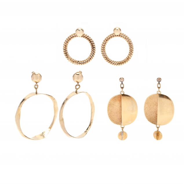 three-pairs-of-gold-earrings