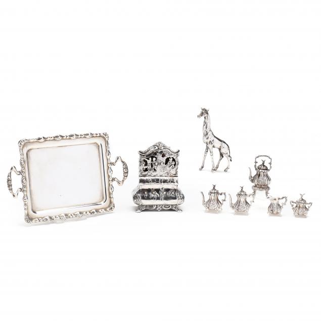 a-miniature-silver-armoire-coffee-tea-service-and-giraffe
