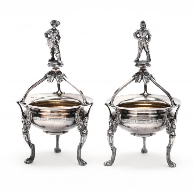 an-exceptional-pair-of-wood-hughes-coin-silver-figural-master-salts
