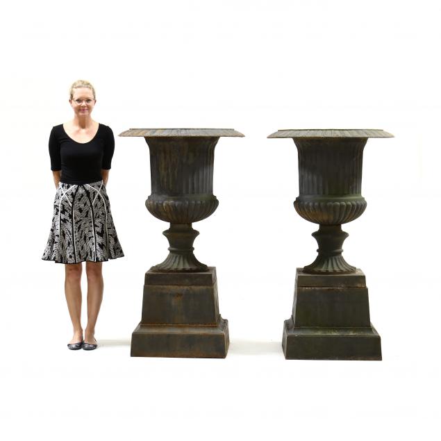 a-massive-pair-of-cast-iron-urns-on-stands