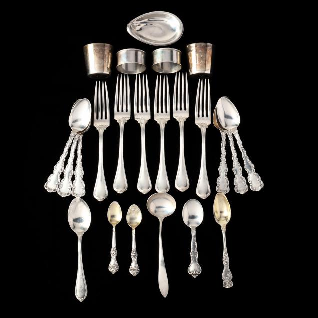 a-grouping-of-sterling-silver-flatware-and-table-accessories