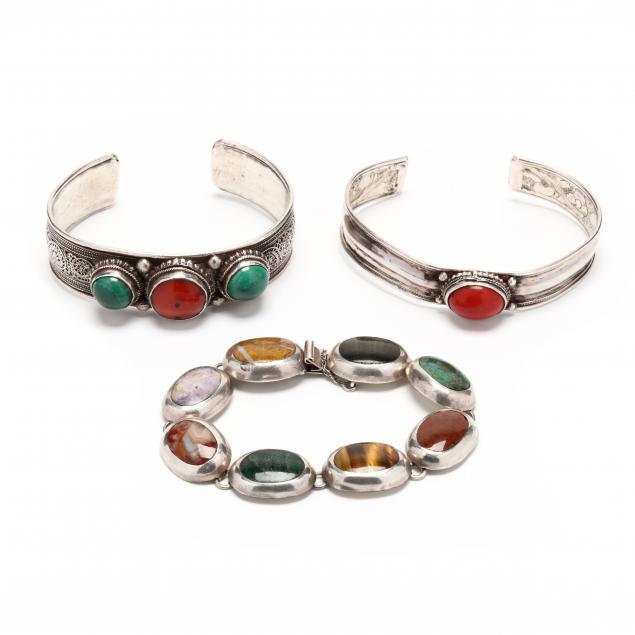 three-silver-and-gem-set-bracelets