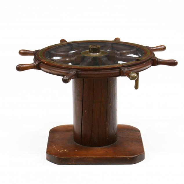 antique-ship-s-wheel-mounted-as-a-side-table