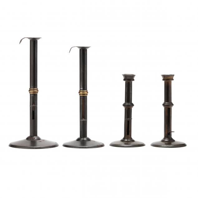 a-grouping-of-four-hogscraper-candlesticks