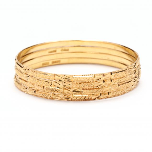 a-set-of-four-gold-bangles-india