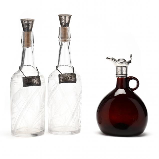 three-silver-mounted-glass-bottles