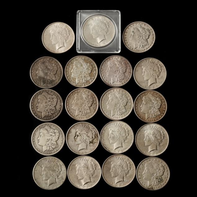 near-roll-of-nineteen-morgan-and-peace-silver-dollars