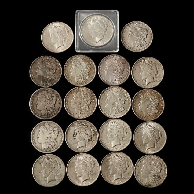 near-roll-of-nineteen-morgan-and-peace-silver-dollars