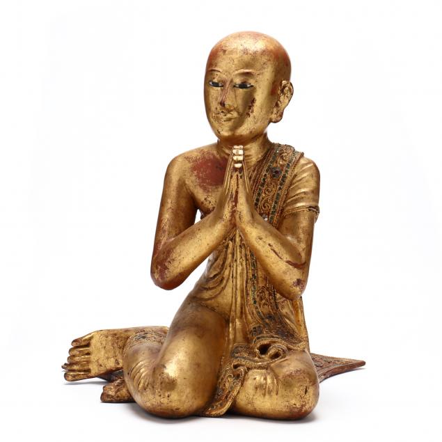 a-burmese-carved-gilt-and-lacquered-kneeling-monk-sculpture