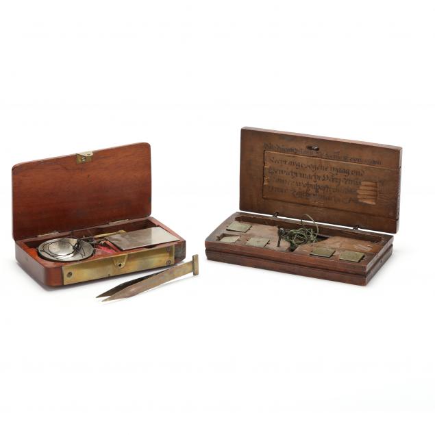 two-cased-merchant-coin-scales-with-weights
