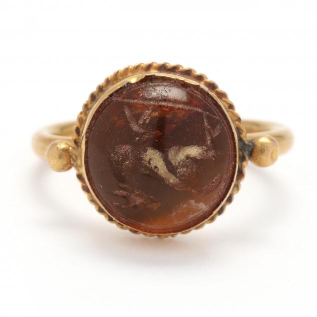 classical-style-gold-ring-set-with-amber-intaglio-ibex-or-gazelle