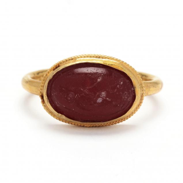 classical-style-gold-ring-with-intaglio-of-a-striding-man