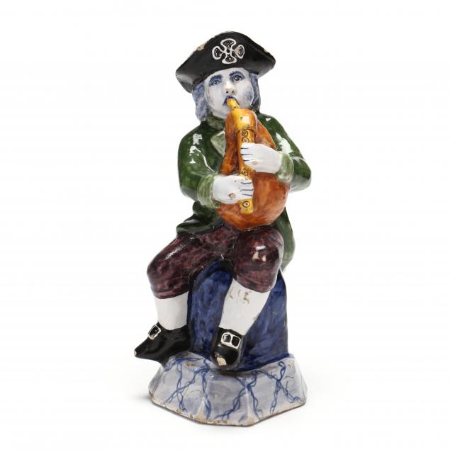 a-dutch-delft-figure-of-a-bagpipe-player