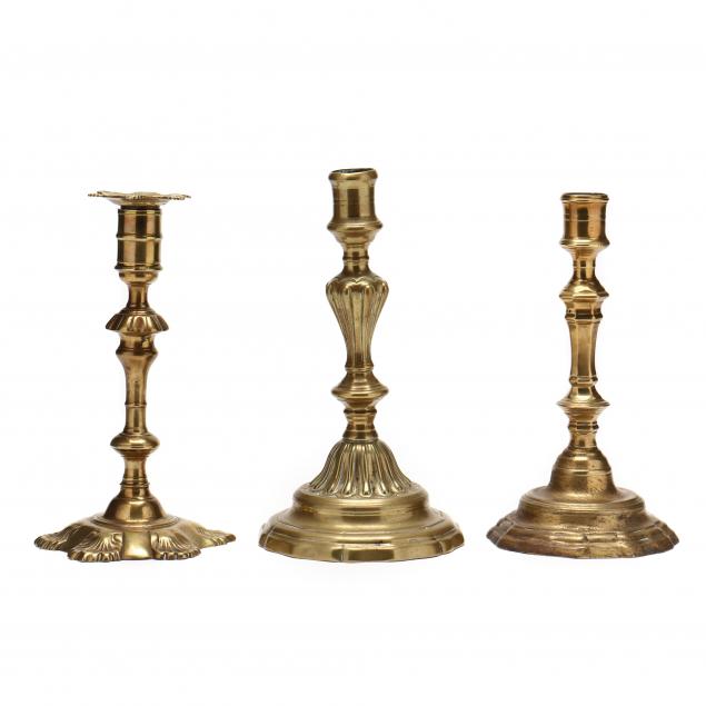 three-18th-century-continental-brass-candlesticks