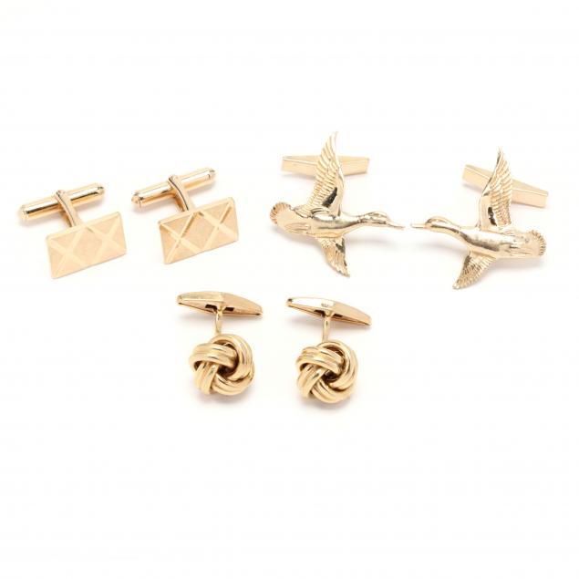 three-pairs-of-gold-cufflinks