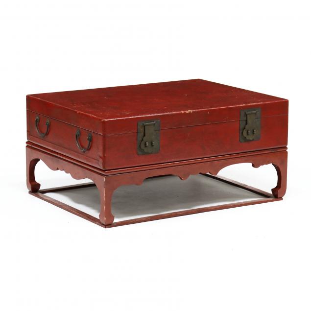chinese-red-lacquered-pigskin-trunk-on-stand