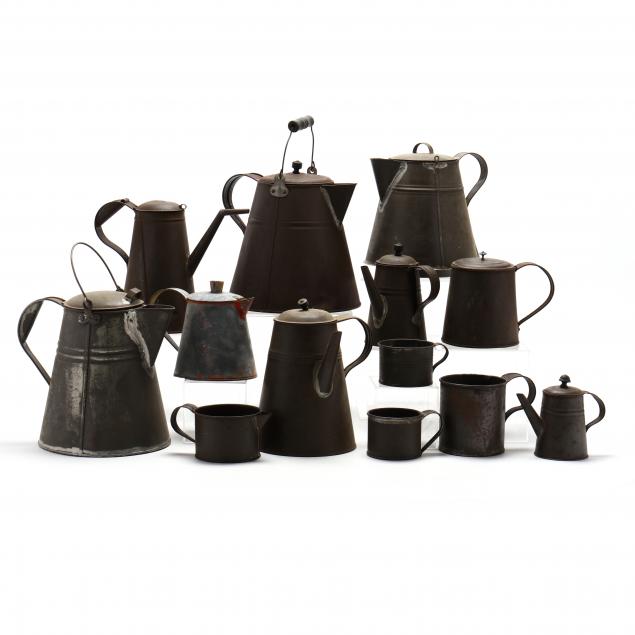 a-collection-of-thirteen-vintage-metal-kettles-and-cups