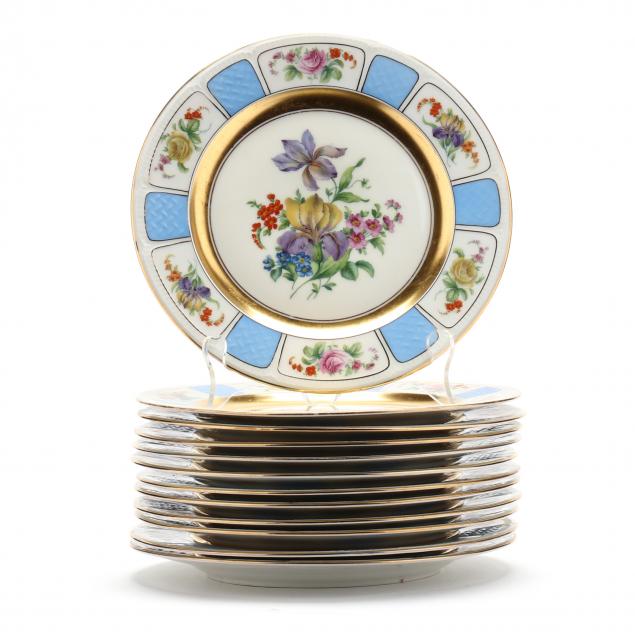 set-of-twelve-black-knight-gilt-porcelain-service-plates
