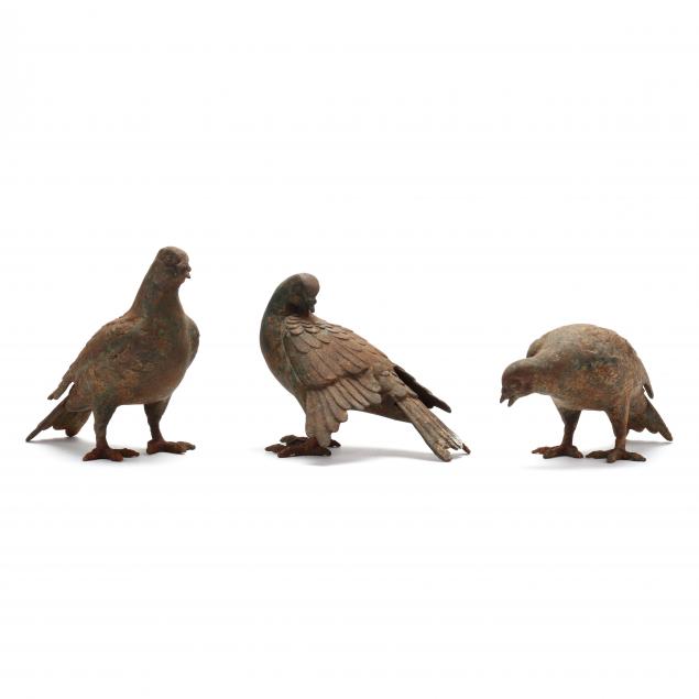 three-vintage-cast-iron-pigeons