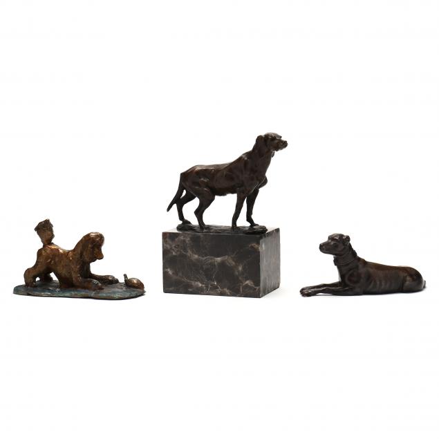 three-cast-sculptures-of-canines