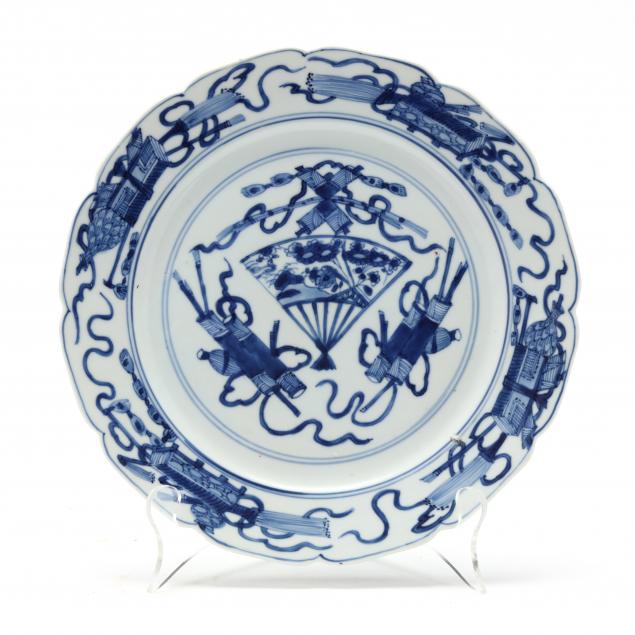 a-chinese-porcelain-plate-with-fan-and-scholar-items