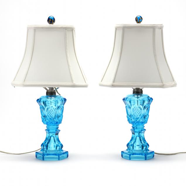 pair-of-bright-blue-pattern-glass-oil-lamps