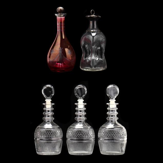 a-group-of-five-decanters