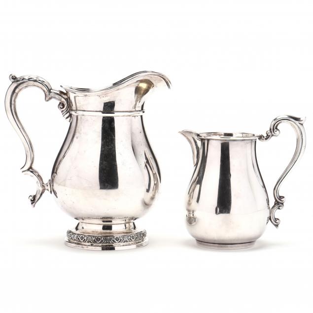 two-sterling-silver-pitchers