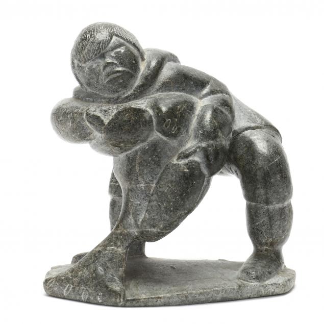 inuit-carved-stone-sculpture-of-figure-with-seal-signed-markooss