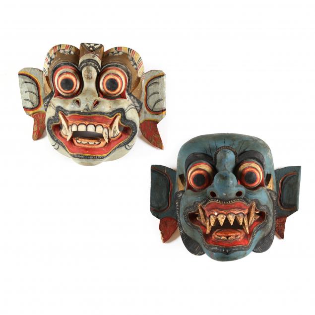 two-indonesian-carved-and-painted-wooden-masks